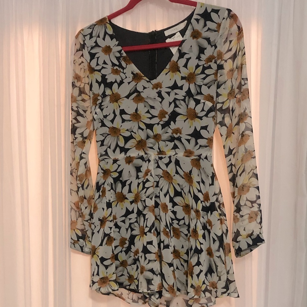 XS Lush Romper with sheer sleeves.